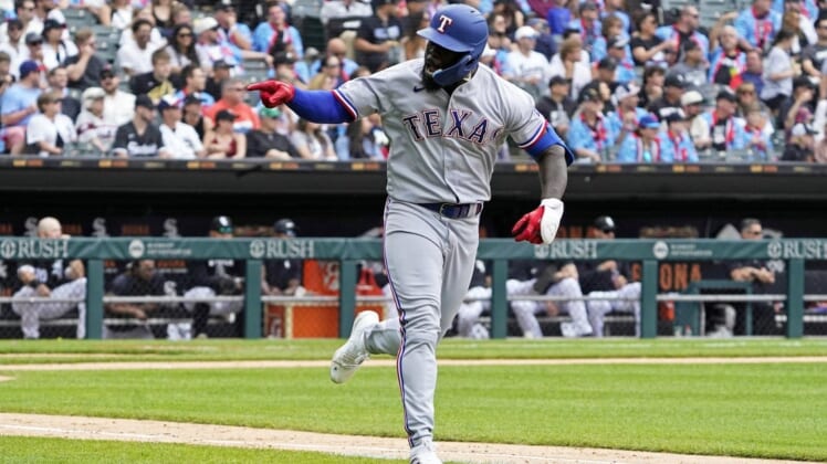 Jun 11, 2022; Chicago, Illinois, USA; Texas Rangers right fielder Adolis Garcia (53) celebrates after hitting a three run home run against the Chicago White Sox during the fifth inning at Guaranteed Rate Field. Mandatory Credit: David Banks-USA TODAY Sports