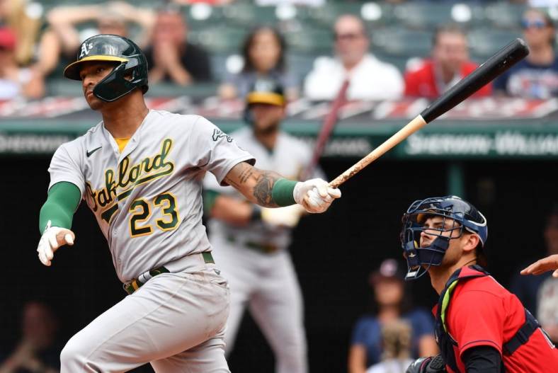 Jun 11, 2022; Cleveland, Ohio, USA; Oakland Athletics first baseman Christian Bethancourt (23) hits an RBI single during the first inning against the Cleveland Guardians at Progressive Field. Mandatory Credit: Ken Blaze-USA TODAY Sports