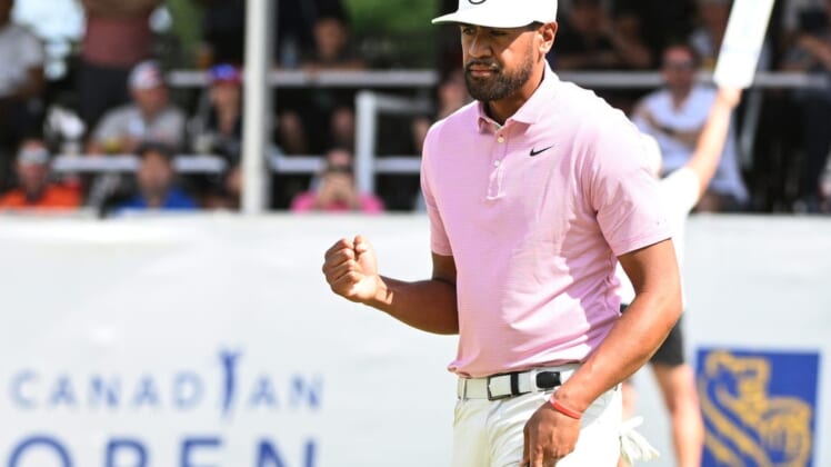 Jun 11, 2022; Etobicoke, Ontario, CAN;   Tony Finau hits a reacts on the 18th green during the third round of the RBC Canadian Open golf tournament. Mandatory Credit: Dan Hamilton-USA TODAY Sports