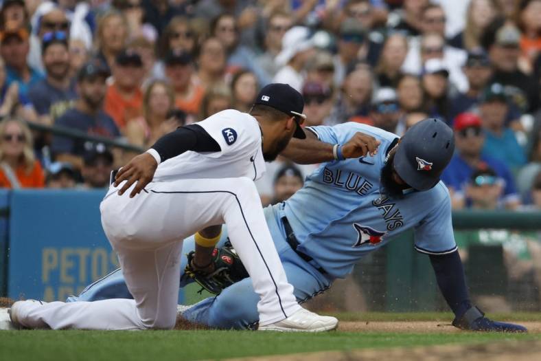 Jun 11, 2022; Detroit, Michigan, USA;  Toronto Blue Jays right fielder Teoscar Hernandez (37) is tagged out at third by Detroit Tigers third baseman Harold Castro (30) in the sixth inning at Comerica Park. Mandatory Credit: Rick Osentoski-USA TODAY Sports