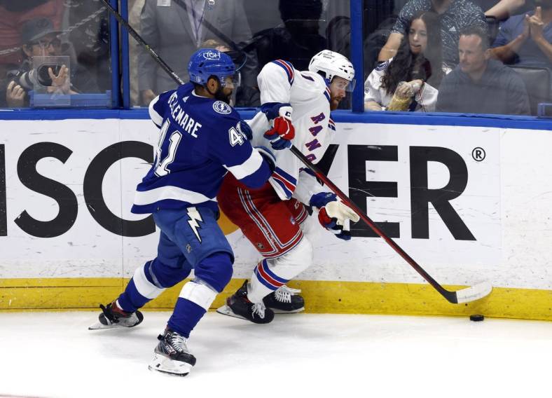Jun 11, 2022; Tampa, Florida, USA; New York Rangers center Kevin Rooney (17) skates with the puck against Tampa Bay Lightning left wing Pierre-Edouard Bellemare (41) during the second period of game six of the Eastern Conference Final of the 2022 Stanley Cup Playoffs at Amalie Arena. Mandatory Credit: Kim Klement-USA TODAY Sports