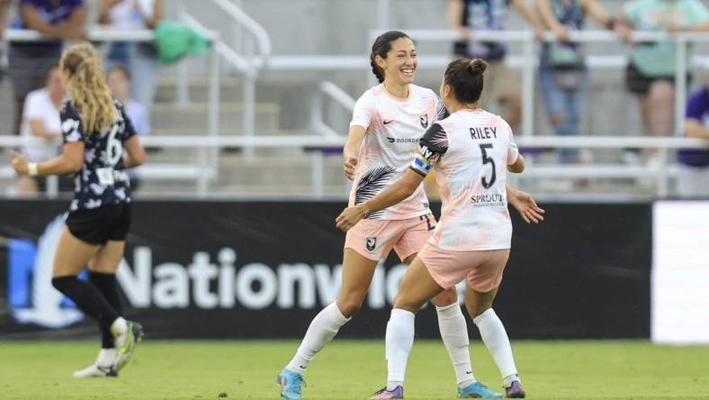 Jun 11, 2022; Louisville, Kentucky, USA;  Angel City FC defender Ali Riley (5) celebrates a goal made by Angel City FC forward Christen Press (23) against Racing Louisville FC during the second half at Lynn Family Stadium. Mandatory Credit: Aaron Doster-USA TODAY Sports