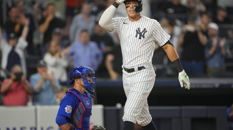 Jun 11, 2022; Bronx, New York, USA; New York Yankees designated hitter Aaron Judge (99) reacts after hitting a home run against the Chicago Cubs during the fifth inning at Yankee Stadium. Mandatory Credit: Gregory Fisher-USA TODAY Sports