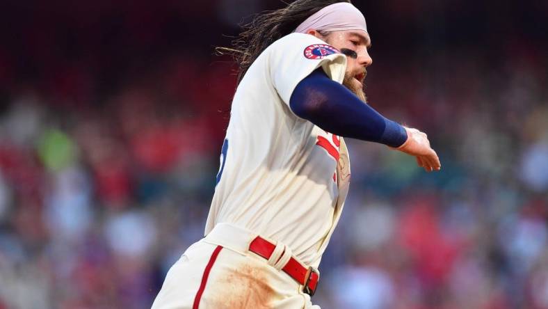 Jun 11, 2022; Anaheim, California, USA; Los Angeles Angels left fielder Brandon Marsh (16) runs home to score against the New York Mets during the first inning at Angel Stadium. Mandatory Credit: Gary A. Vasquez-USA TODAY Sports