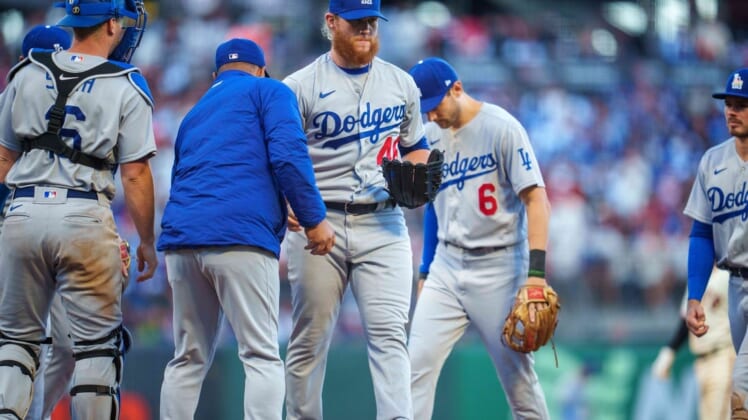 Jun 11, 2022; San Francisco, California, USA;  Los Angeles Dodgers manager Dave Roberts (30) relmoves relief pitcher Craig Kimbrel (46) during the eighth inning against the San Francisco Giants at Oracle Park. Mandatory Credit: Neville E. Guard-USA TODAY Sports