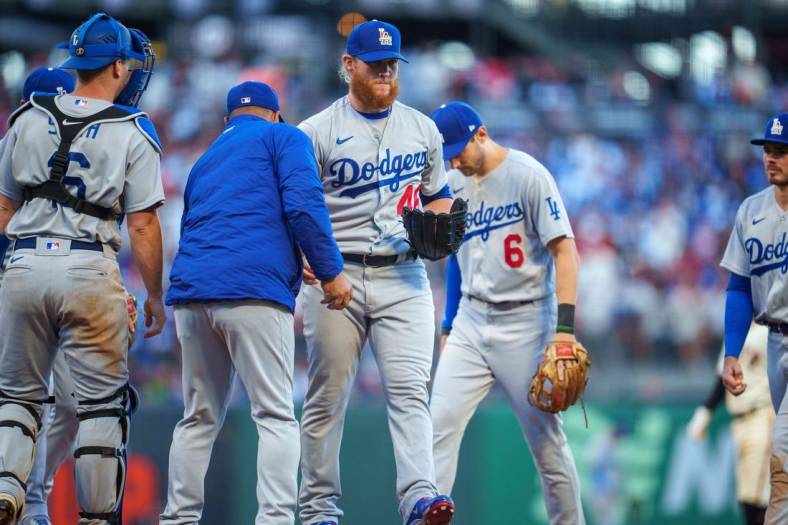 Jun 11, 2022; San Francisco, California, USA;  Los Angeles Dodgers manager Dave Roberts (30) relmoves relief pitcher Craig Kimbrel (46) during the eighth inning against the San Francisco Giants at Oracle Park. Mandatory Credit: Neville E. Guard-USA TODAY Sports