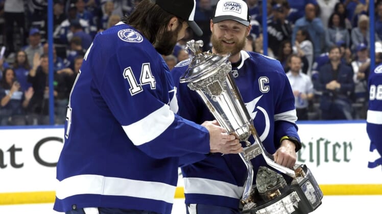 Jun 11, 2022; Tampa, Florida, USA; Tampa Bay Lightning center Steven Stamkos (91) celebrates with left wing Pat Maroon (14) as he holds the Prince of Wales Trophy after defeating the New York Rangers in game six of the Eastern Conference Final of the 2022 Stanley Cup Playoffs at Amalie Arena. Mandatory Credit: Kim Klement-USA TODAY Sports