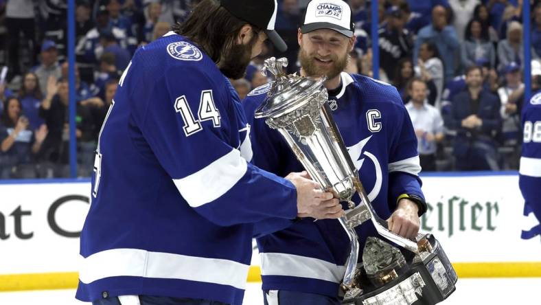 Jun 11, 2022; Tampa, Florida, USA; Tampa Bay Lightning center Steven Stamkos (91) celebrates with left wing Pat Maroon (14) as he holds the Prince of Wales Trophy after defeating the New York Rangers in game six of the Eastern Conference Final of the 2022 Stanley Cup Playoffs at Amalie Arena. Mandatory Credit: Kim Klement-USA TODAY Sports