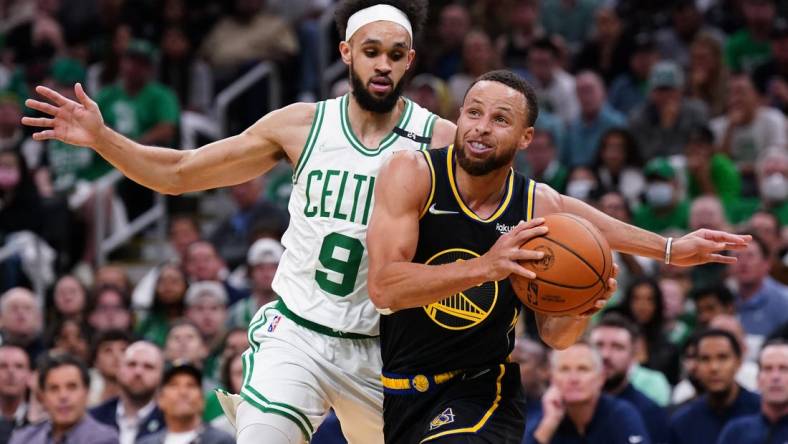 Jun 10, 2022; Boston, Massachusetts, USA; Golden State Warriors guard Stephen Curry (30) drives the ball against Boston Celtics guard Derrick White (9) in the first quarter during game four of the 2022 NBA Finals at TD Garden. Mandatory Credit: David Butler II-USA TODAY Sports