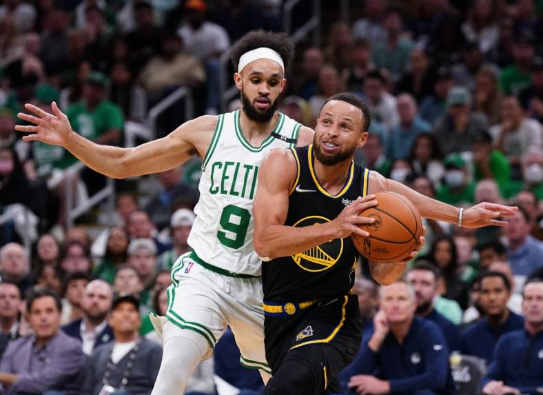 Jun 10, 2022; Boston, Massachusetts, USA; Golden State Warriors guard Stephen Curry (30) drives the ball against Boston Celtics guard Derrick White (9) in the first quarter during game four of the 2022 NBA Finals at TD Garden. Mandatory Credit: David Butler II-USA TODAY Sports