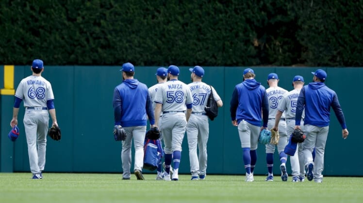 Jun 12, 2022; Detroit, Michigan, USA;  Toronto Blue Jays pitchers walk to the bullpen before the first inning against the Detroit Tigers at Comerica Park. Mandatory Credit: Rick Osentoski-USA TODAY Sports