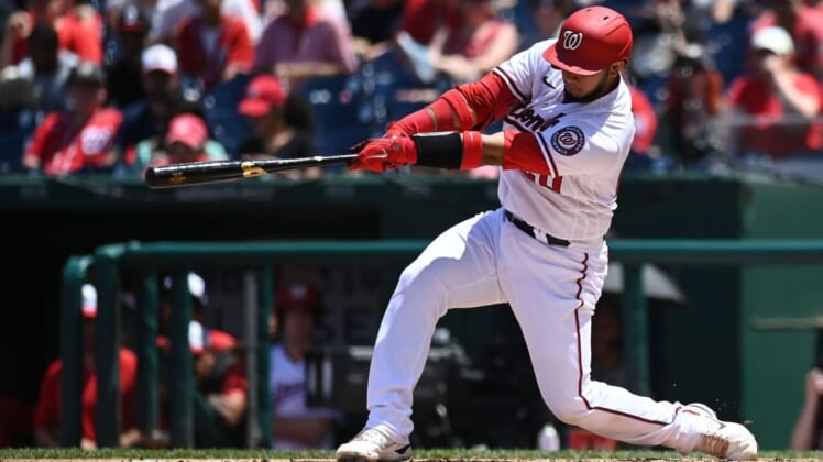 Jun 12, 2022; Washington, District of Columbia, USA; Washington Nationals catcher Keibert Ruiz (20) doubles in the second inning against the Milwaukee Brewers  at Nationals Park. Mandatory Credit: Tommy Gilligan-USA TODAY Sports