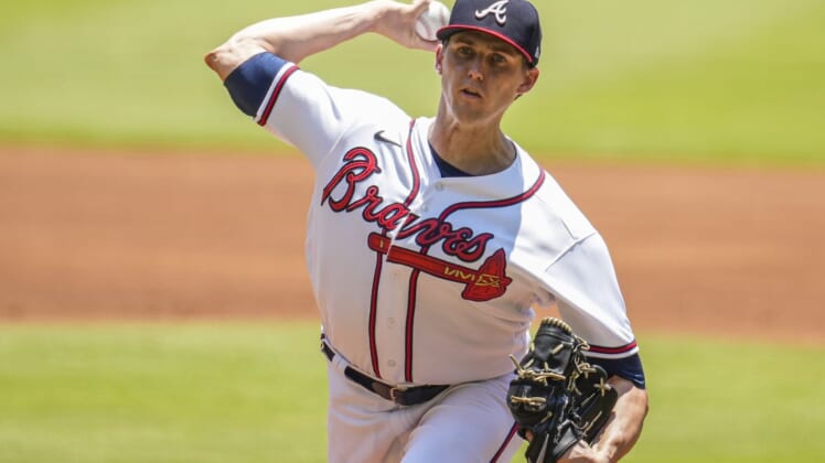 Jun 12, 2022; Cumberland, Georgia, USA; Atlanta Braves starting pitcher Kyle Wright (30) pitches against the Pittsburgh Pirates during the first inning at Truist Park. Mandatory Credit: Dale Zanine-USA TODAY Sports