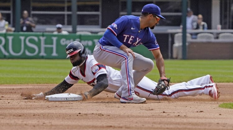 Jun 12, 2022; Chicago, Illinois, USA; Chicago White Sox center fielder Luis Robert (88) steals second base as Texas Rangers second baseman Marcus Semien (2) takes the throw during the first inning at Guaranteed Rate Field. Mandatory Credit: David Banks-USA TODAY Sports