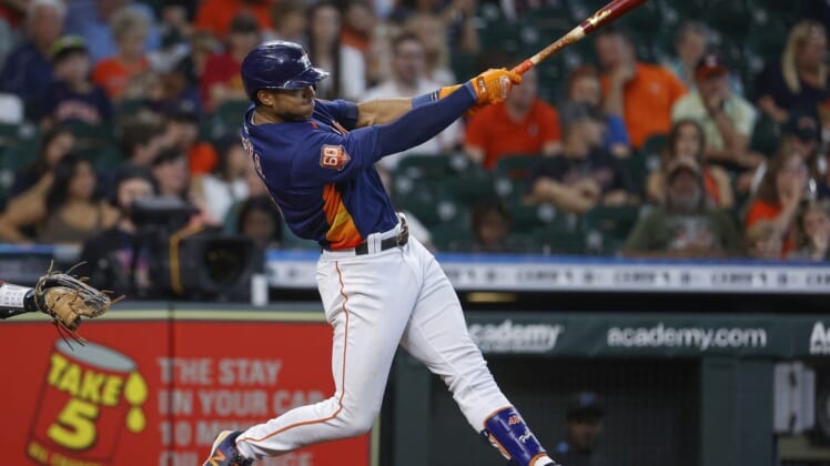 Jun 12, 2022; Houston, Texas, USA; Houston Astros shortstop Jeremy Pena (3) hits a home run during the fourth inning against the Miami Marlins at Minute Maid Park. Mandatory Credit: Troy Taormina-USA TODAY Sports