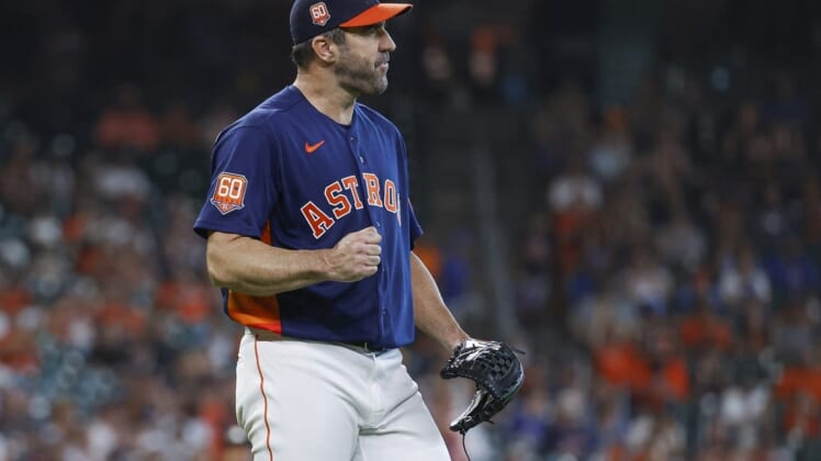 Jun 12, 2022; Houston, Texas, USA; Houston Astros starting pitcher Justin Verlander (35) reacts after a defensive play during the seventh inning against the Miami Marlins at Minute Maid Park. Mandatory Credit: Troy Taormina-USA TODAY Sports