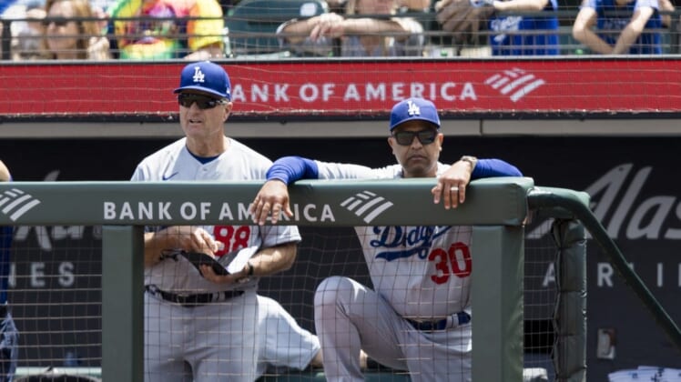 Jun 12, 2022; San Francisco, California, USA; Los Angeles Dodgers bench coach Bob Geren (88) and manager Dave Roberts (30) during the fourth inning against the San Francisco Giants at Oracle Park. Mandatory Credit: John Hefti-USA TODAY Sports