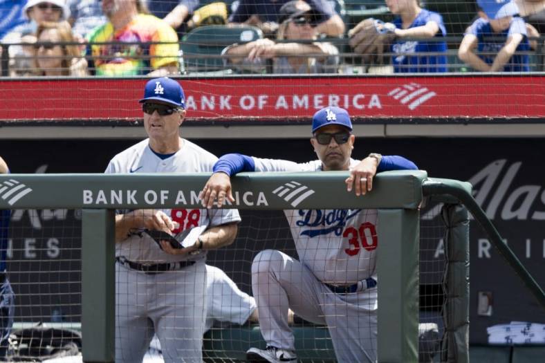 Jun 12, 2022; San Francisco, California, USA; Los Angeles Dodgers bench coach Bob Geren (88) and manager Dave Roberts (30) during the fourth inning against the San Francisco Giants at Oracle Park. Mandatory Credit: John Hefti-USA TODAY Sports