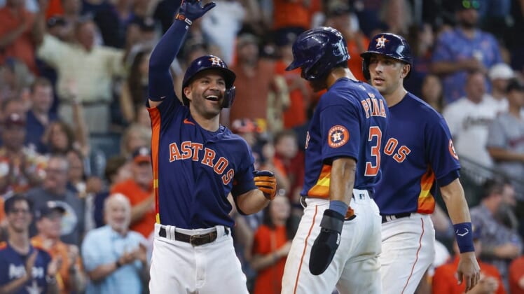 Jun 12, 2022; Houston, Texas, USA; Houston Astros second baseman Jose Altuve (27) celebrates with Jeremy Pena after hitting a home run during the eighth inning against the Miami Marlins at Minute Maid Park. Mandatory Credit: Troy Taormina-USA TODAY Sports