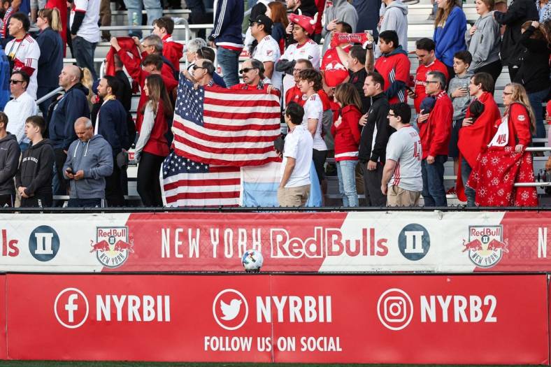 May 25, 2022; Montclair, New Jersey, USA; Fan stand for the national anthem before the game between the New York Red Bulls and Charlotte FC at Montclair State University Soccer Park. Mandatory Credit: Vincent Carchietta-USA TODAY Sports