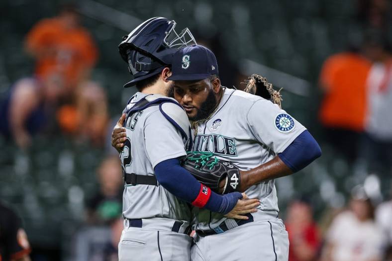 Jun 2, 2022; Baltimore, Maryland, USA; Seattle Mariners catcher Luis Torrens (22) celebrates with relief pitcher Diego Castillo (63) after the final pitch of the game against the Baltimore Orioles at Oriole Park at Camden Yards. Mandatory Credit: Scott Taetsch-USA TODAY Sports