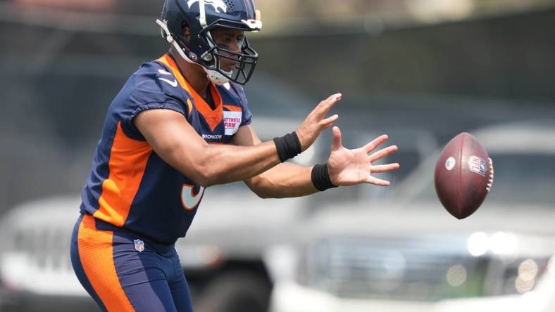 Jun 13, 2022; Englewood, CO, USA; Denver Broncos quarterback Russell Wilson (3) during mini camp drills at the UCHealth Training Center. Mandatory Credit: Ron Chenoy-USA TODAY Sports