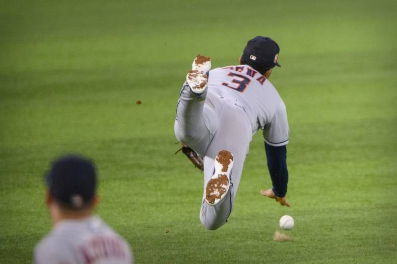 Jun 13, 2022; Arlington, Texas, USA; Houston Astros shortstop Jeremy Pena (3) dives but cannot catch a fly ball hit by Texas Rangers shortstop Corey Seager (not pictured) during the third inning at Globe Life Field. Mandatory Credit: Jerome Miron-USA TODAY Sports