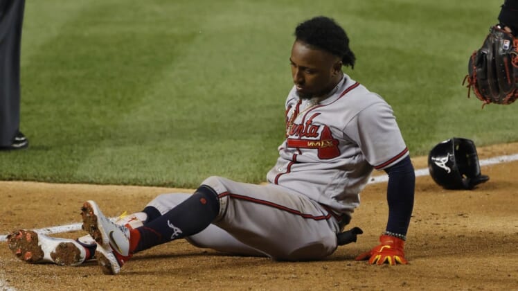 Jun 13, 2022; Washington, District of Columbia, USA; Atlanta Braves third baseman Ozzie Albies (1) sits at the batter's box after being injured while batting against the Washington Nationals during the fifth inning at Nationals Park. Mandatory Credit: Geoff Burke-USA TODAY Sports