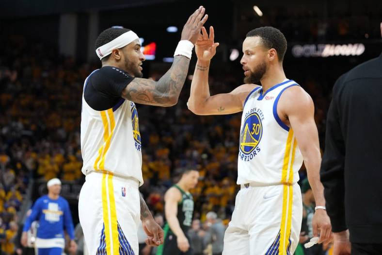 Jun 13, 2022; San Francisco, California, USA; Golden State Warriors guard Stephen Curry (30) celebrates with  guard Gary Payton II (left) after defeating the Boston Celtics in game five of the 2022 NBA Finals at Chase Center. Mandatory Credit: Kyle Terada-USA TODAY Sports