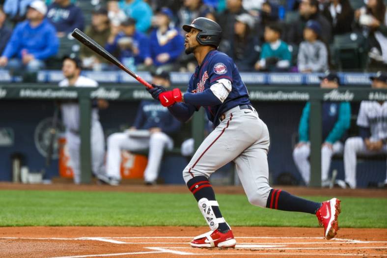 Jun 13, 2022; Seattle, Washington, USA; Minnesota Twins designated hitter Byron Buxton (25) hits a two-run home run against the Seattle Mariners during the first inning at T-Mobile Park. Mandatory Credit: Joe Nicholson-USA TODAY Sports