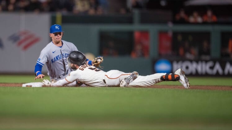Jun 13, 2022; San Francisco, California, USA;  San Francisco Giants right fielder Luis Gonzalez (51) dives in safely for a double during the eighth inning against Kansas City Royals shortstop Bobby Witt Jr. (7) at Oracle Park. Mandatory Credit: Neville E. Guard-USA TODAY Sports