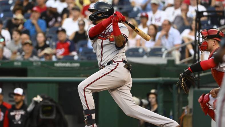 Jun 14, 2022; Washington, District of Columbia, USA; Atlanta Braves second baseman Orlando Arcia (11) this an RBI sacrifice fly against the Washington Nationals during the second inning at Nationals Park. Mandatory Credit: Brad Mills-USA TODAY Sports