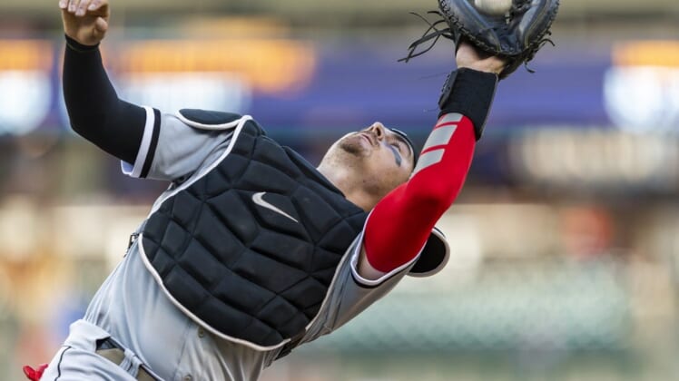 Jun 14, 2022; Detroit, Michigan, USA; Chicago White Sox catcher Reese McGuire (21) makes a catch for an out during the third inning against the Detroit Tigers at Comerica Park. Mandatory Credit: Raj Mehta-USA TODAY Sports