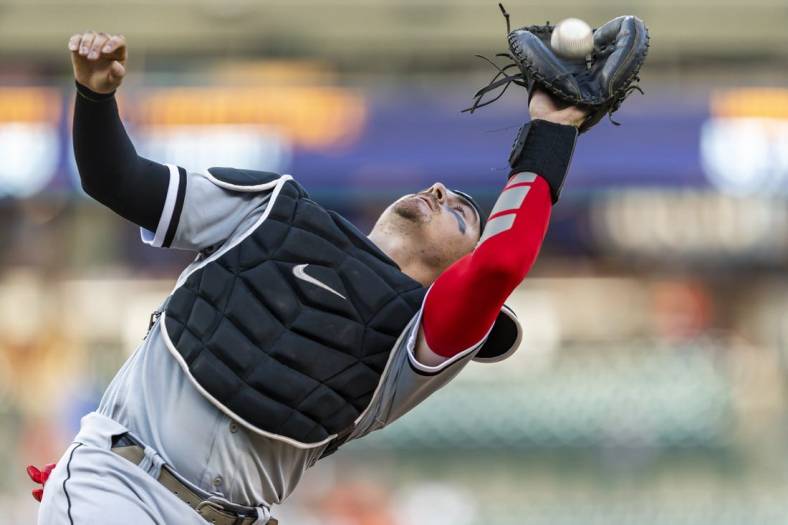 Jun 14, 2022; Detroit, Michigan, USA; Chicago White Sox catcher Reese McGuire (21) makes a catch for an out during the third inning against the Detroit Tigers at Comerica Park. Mandatory Credit: Raj Mehta-USA TODAY Sports