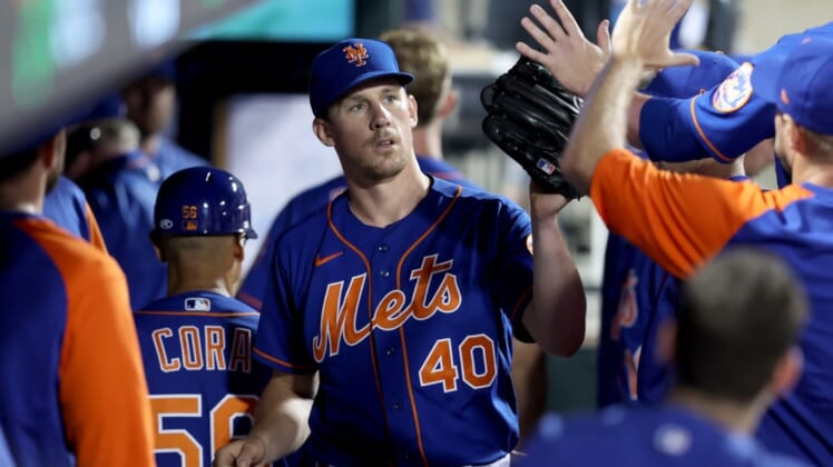 Jun 14, 2022; New York City, New York, USA; New York Mets starting pitcher Chris Bassitt (40) is congratulated bu teammates in the dugout during the eighth inning against the Milwaukee Brewers at Citi Field. Mandatory Credit: Brad Penner-USA TODAY Sports