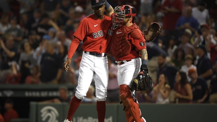 Jun 14, 2022; Boston, Massachusetts, USA;  Boston Red Sox relief pitcher Phillips Valdez (71) is congratulated by catcher Christian Vazquez (7) after defeating the Oakland Athletics at Fenway Park. Mandatory Credit: Bob DeChiara-USA TODAY Sports