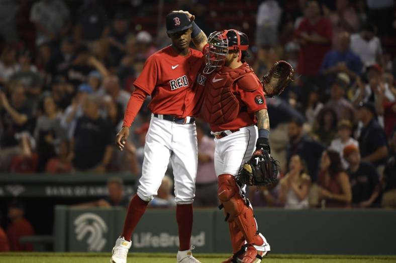 Jun 14, 2022; Boston, Massachusetts, USA;  Boston Red Sox relief pitcher Phillips Valdez (71) is congratulated by catcher Christian Vazquez (7) after defeating the Oakland Athletics at Fenway Park. Mandatory Credit: Bob DeChiara-USA TODAY Sports