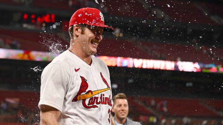 Jun 14, 2022; St. Louis, Missouri, USA;  St. Louis Cardinals starting pitcher Miles Mikolas (39) is sprayed with water by pitching coach Mike Maddux (not pictured) after Mikolas pitched 8 2/3 inning giving up one hit in a victory over the Pittsburgh Pirates at Busch Stadium. Mandatory Credit: Jeff Curry-USA TODAY Sports