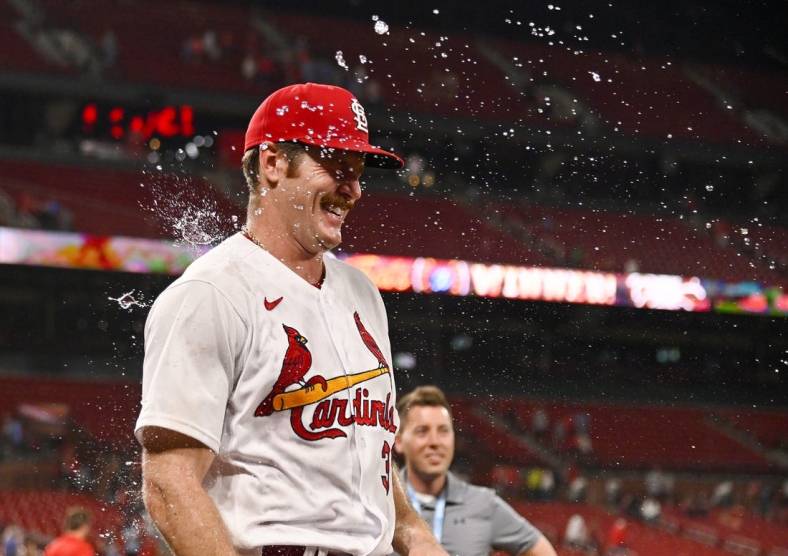 Jun 14, 2022; St. Louis, Missouri, USA;  St. Louis Cardinals starting pitcher Miles Mikolas (39) is sprayed with water by pitching coach Mike Maddux (not pictured) after Mikolas pitched 8 2/3 inning giving up one hit in a victory over the Pittsburgh Pirates at Busch Stadium. Mandatory Credit: Jeff Curry-USA TODAY Sports
