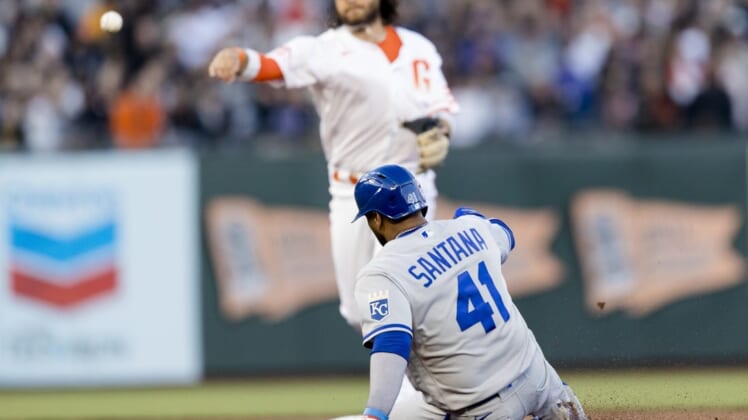 Jun 14, 2022; San Francisco, California, USA; Kansas City Royals first baseman Carlos Santana (41) is tagged out by San Francisco Giants shortstop Brandon Crawford (35) in the first part of a double play during the fifth inning at Oracle Park. Mandatory Credit: John Hefti-USA TODAY Sports