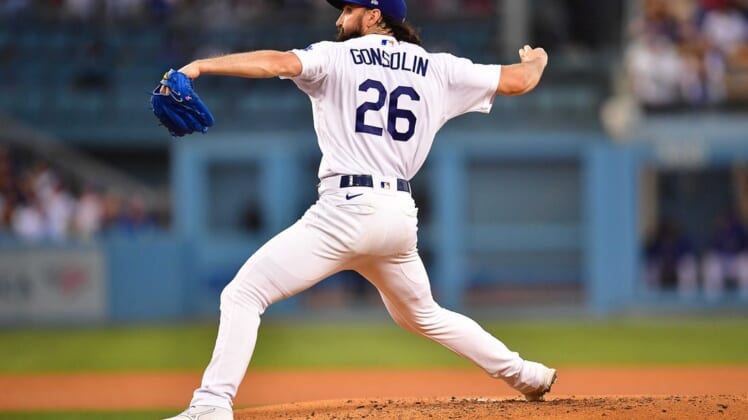 Jun 14, 2022; Los Angeles, California, USA; Los Angeles Dodgers starting pitcher Tony Gonsolin (26) throws against the Los Angeles Angels during the fourth inning at Dodger Stadium. Mandatory Credit: Gary A. Vasquez-USA TODAY Sports