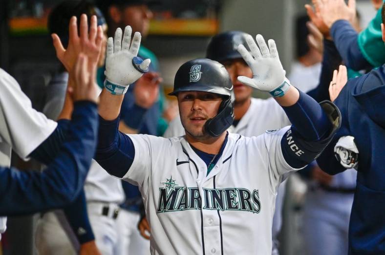 Jun 14, 2022; Seattle, Washington, USA; Seattle Mariners first baseman Ty France (23) celebrates in the dugout after hitting a 2-run home run against the Minnesota Twins during the fifth inning at T-Mobile Park. Mandatory Credit: Steven Bisig-USA TODAY Sports
