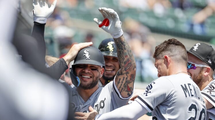 Jun 15, 2022; Detroit, Michigan, USA; Chicago White Sox third baseman Yoan Moncada (10) receives congratulations from teammatesnafter after he hit a three run home run against the Detroit Tigers in the first inning at Comerica Park. Mandatory Credit: Rick Osentoski-USA TODAY Sports