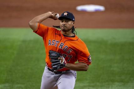 Jun 15, 2022; Arlington, Texas, USA; Houston Astros starting pitcher Luis Garcia (77) pitches against the Texas Rangers during the first inning at Globe Life Field. Mandatory Credit: Jerome Miron-USA TODAY Sports
