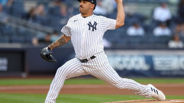 Jun 15, 2022; Bronx, New York, USA; New York Yankees starting pitcher Nestor Cortes (65) delivers a pitch during the first inning against the Tampa Bay Rays at Yankee Stadium. Mandatory Credit: Vincent Carchietta-USA TODAY Sports