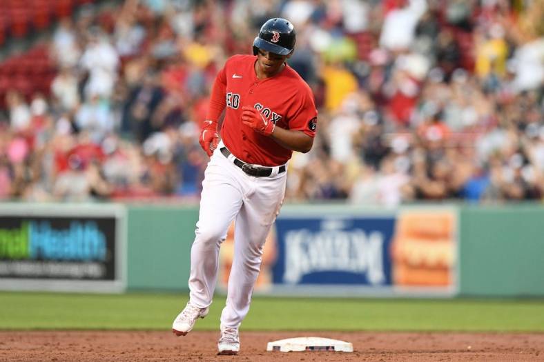 Jun 15, 2022; Boston, Massachusetts, USA; Boston Red Sox third baseman Rafael Devers (11) runs the bases after hitting a two-run home run against the Oakland Athletics during the second inning at Fenway Park. Mandatory Credit: Brian Fluharty-USA TODAY Sports