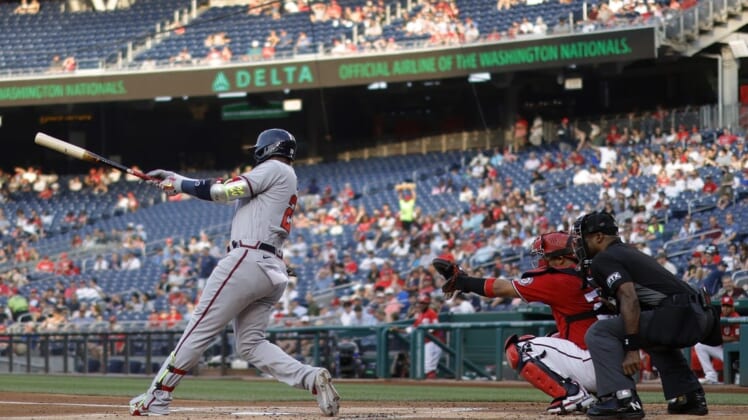 Jun 15, 2022; Washington, District of Columbia, USA; Atlanta Braves designated hitter Marcell Ozuna (20) hits a double against the Washington Nationals during the second inning at Nationals Park. Mandatory Credit: Geoff Burke-USA TODAY Sports