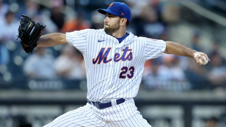 Jun 15, 2022; New York City, New York, USA; New York Mets starting pitcher David Peterson (23) pitches against the Milwaukee Brewers during the third inning at Citi Field. Mandatory Credit: Brad Penner-USA TODAY Sports
