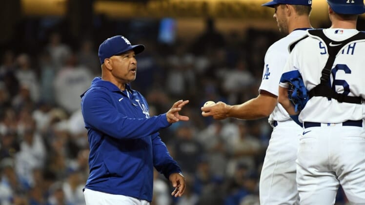 Jun 15, 2022; Los Angeles, California, USA; Los Angeles Dodgers manager Dave Roberts (30) relieves starting pitcher Tyler Anderson (31) in the ninth inning against the Los Angeles Angels at Dodger Stadium. Mandatory Credit: Richard Mackson-USA TODAY Sports