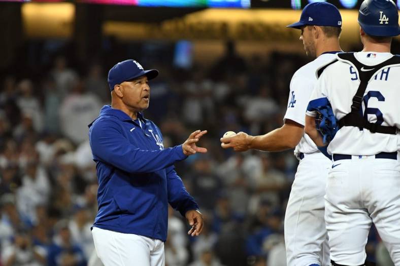 Jun 15, 2022; Los Angeles, California, USA; Los Angeles Dodgers manager Dave Roberts (30) relieves starting pitcher Tyler Anderson (31) in the ninth inning against the Los Angeles Angels at Dodger Stadium. Mandatory Credit: Richard Mackson-USA TODAY Sports